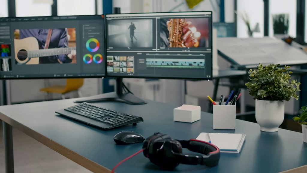 Empty creative multimedia studio with professional computer placed on desk